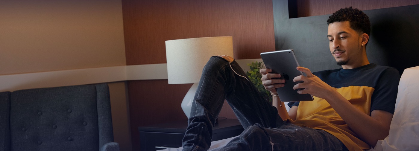 Patient at Sunrise Detox Center reading on his bed