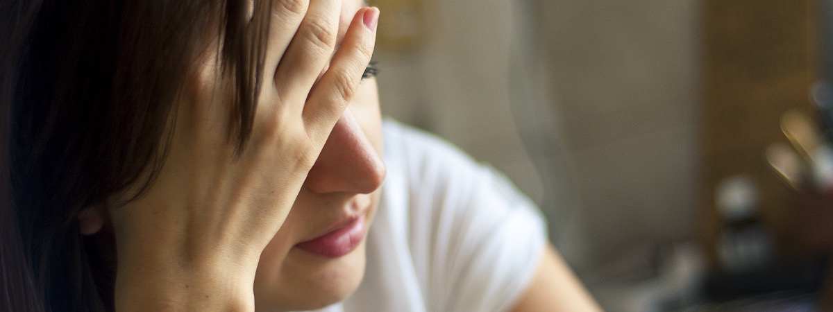 Stressed woman in white tshirt